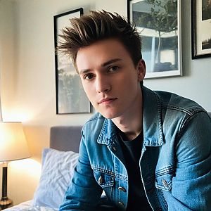 Thoughtful Young Man in Cozy Room