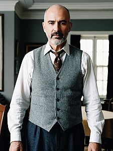 Mature Man in Classic Gray Vest and Tie Portrait