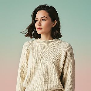 Young Woman in Cream Knit Sweater with Soft Gradient Background