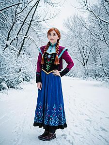 Woman in Traditional Costume in Snowy Landscape