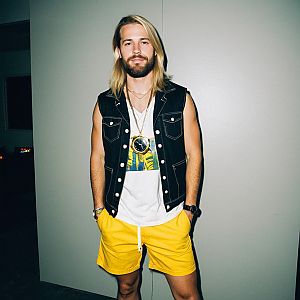 Confident man in rave-inspired outfit