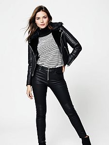 Woman in Casual Chic Black Leather Biker Jacket with Faux Fur Collar