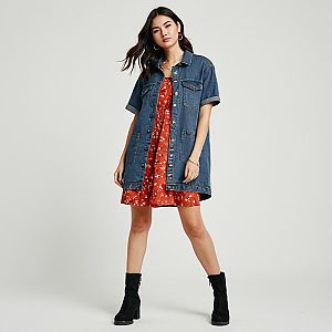 Woman in Red Floral Mini Dress with Denim Jacket