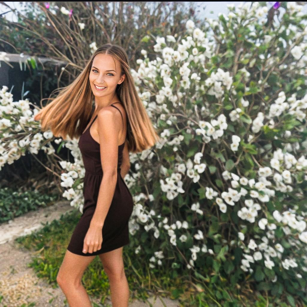 Joyful Woman in Blooming Flowers Joyful Woman in Blooming Flowers