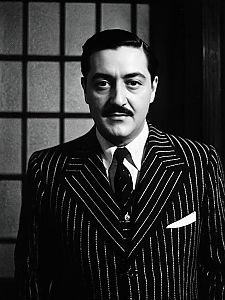 Man in Gomez Addams Costume Vintage Pinstripe Suit Editorial Fashion