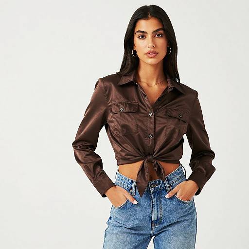 Woman Wearing Dark Brown Satin Tie-Front Shirt with Blue Jeans