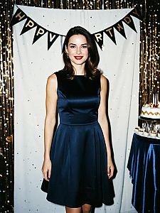 Elegant Woman at Satin Dress Birthday Party Celebration