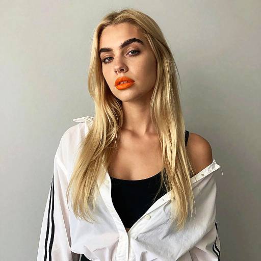 Portrait of Blonde Woman with Orange Lipstick in Casual White Shirt