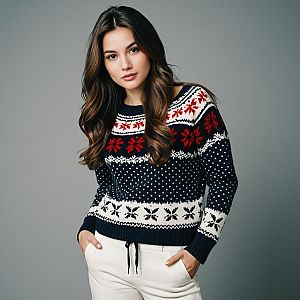 Woman Wearing Fair Isle Christmas Sweater with Red and White Patterns