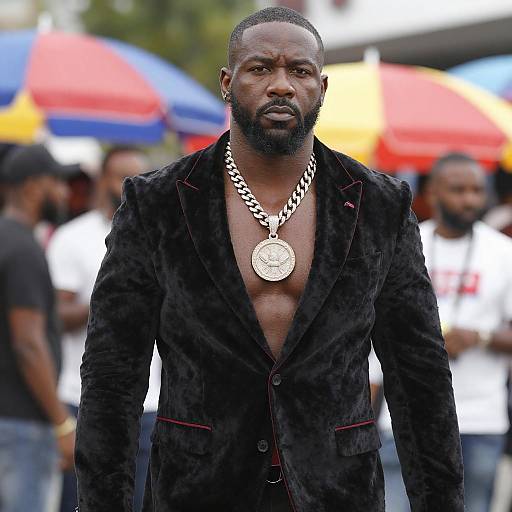 Man in Black Velvet Blazer Wearing Large Silver Chain Necklace Outdoors