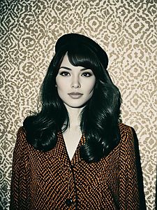 Elegant Woman in Retro Houndstooth Coat and Black Beret Portrait