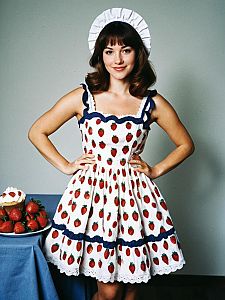Vintage Strawberry Print Dress Woman Smiling with Cupcake and Strawberries