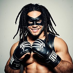 Muscular Man in Leather Mask with Dreadlocks