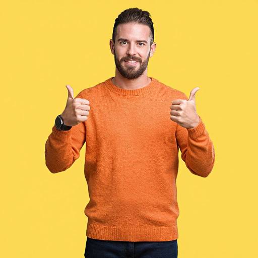 Man in Orange Sweater Giving Thumbs Up on Yellow Background
