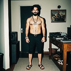 Bearded man in vintage room with accessories