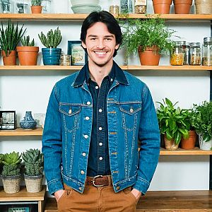 Young man with plants in a cozy setting