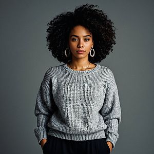 Confident Young Woman in Grey Sweater