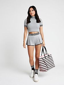 Woman in Casual Sporty Grey Ribbed Knit Mock Turtleneck Crop Top and Pleated Shorts