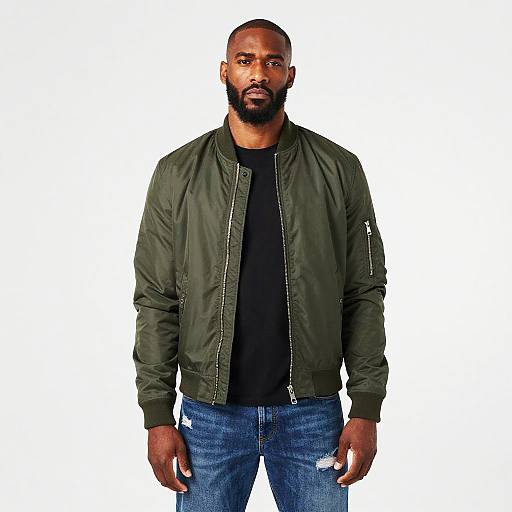 Man Wearing Green Bomber Jacket and Distressed Jeans Gen Z Style