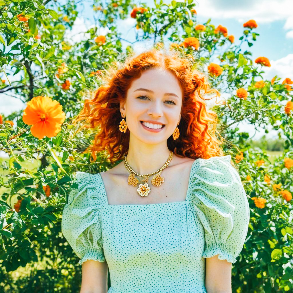 Smiling Woman in Green Dress Among Orange Flowers Smiling Woman in Green Dress Among Orange Flowers