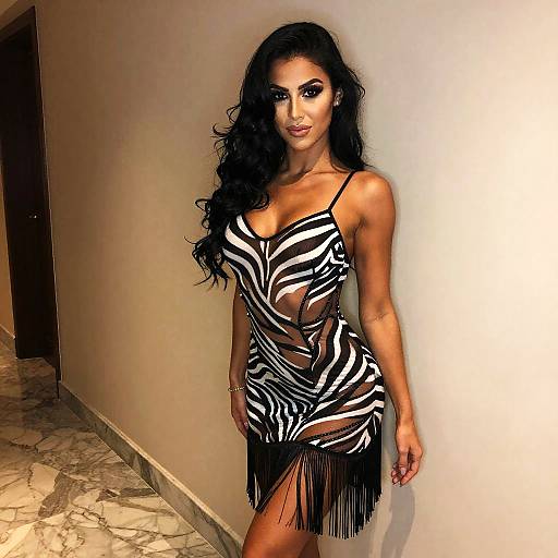 Woman in Stylish Zebra Print Sheer Dress with Fringe Detailing