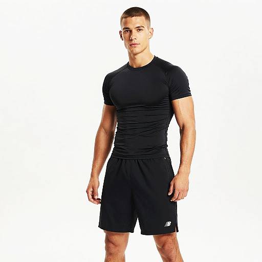 Fit Man Wearing Black Compression Shirt and Athletic Shorts