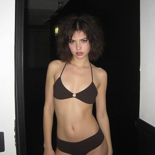 Woman in Dark Brown Bikini with Curly Hair Pose