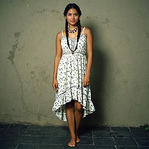 Young Woman in Floral Dress with Braids