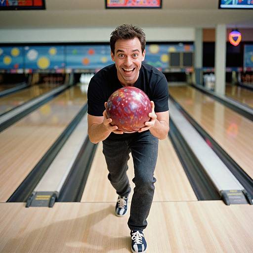Happy Man Bowling with Marbled Ball in Bowling Alley