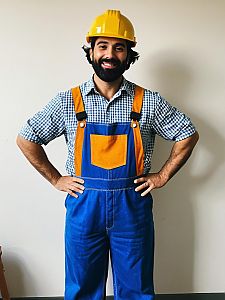 Man Wearing Bob Builder Costume with Yellow Hard Hat and Blue Overalls