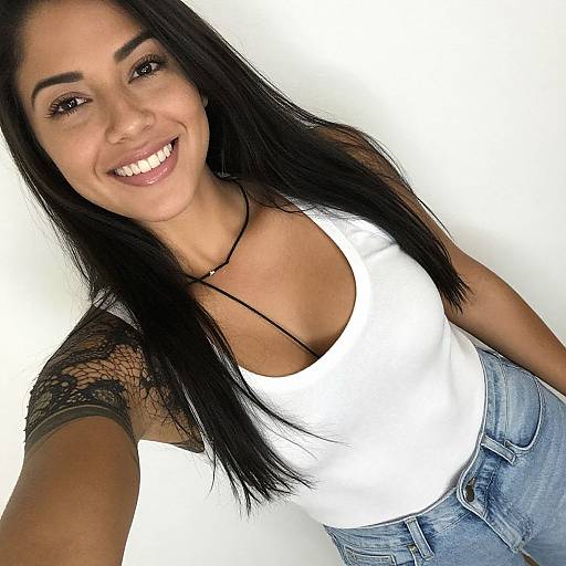 Smiling Woman in White Tank Top with Tattoo Sleeve Casual Style