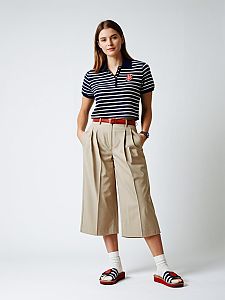 Woman Wearing Navy Blue and White Striped Polo Shirt with Beige Cropped Pants Casual Preppy Outfit