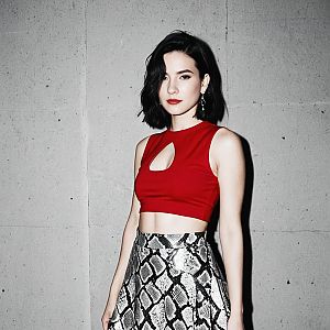Stylish Woman in Red Crop Top and Snakeskin Skirt