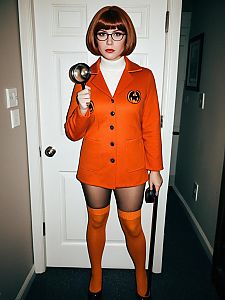Woman in Velma Halloween Costume Full Body Cosplay with Magnifying Glass