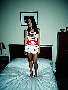 Woman in Noisy Night One Stand Fancy Dress on Bed in Bedroom