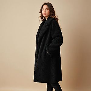 Confident Woman in Cozy Black Textured Coat