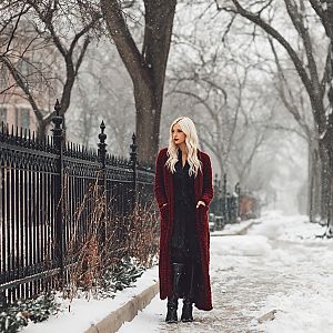 Blonde Woman in Red Cardigan on Snowy Sidewalk