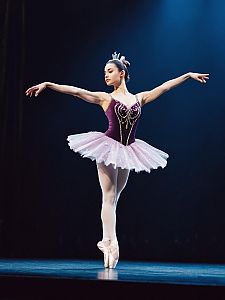 Woman in Sugar Plum Fairy Ballet Costume Full Body Pose on Stage