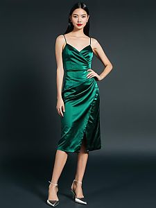 Elegant Woman in Emerald Green Satin Wrap Dress with Front Slit