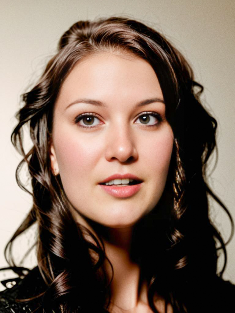 Woman with Cascading Curls in Soft Light