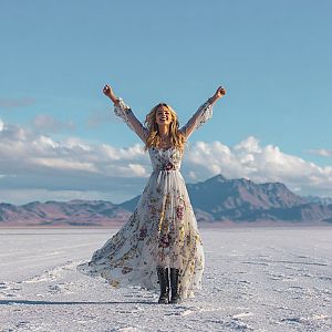 Joyful Woman in Floral Dress on Salt Flat