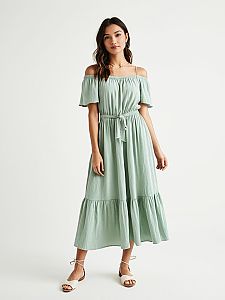 Woman in Bohemian Chic Pale Mint Green Off-the-Shoulder Midi Dress