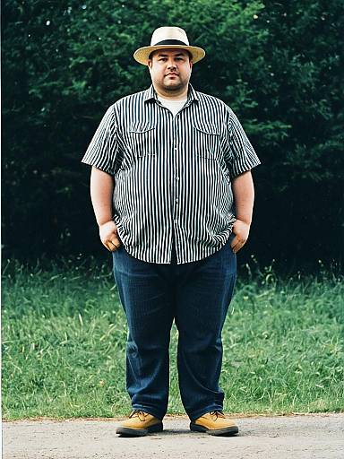 Plus Size Man Wearing Striped Shirt and Fedora Hat Outdoors