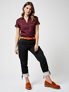 Woman Wearing Maroon Shirt with Black Cargo Pants and Orange Belt