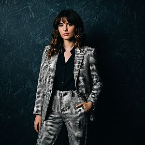 Confident Woman in Houndstooth Suit