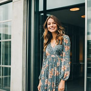 Young Woman in Floral Dress Outside Modern Building