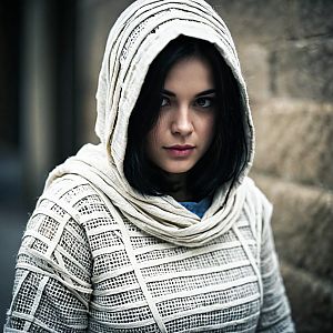 Confident Woman in Cream Hooded Garment