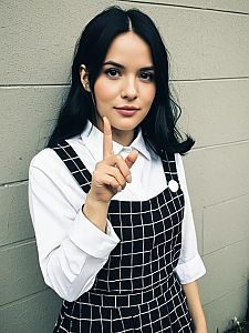Confident Woman in Black and White Checkered Dress Pointing Finger