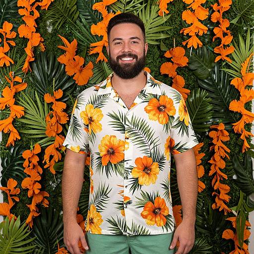 Smiling Man in Bright Hawaiian Shirt with Tropical Floral Background