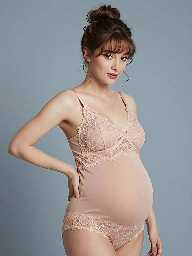 Pregnant Woman in Nude Lace Maternity Lingerie